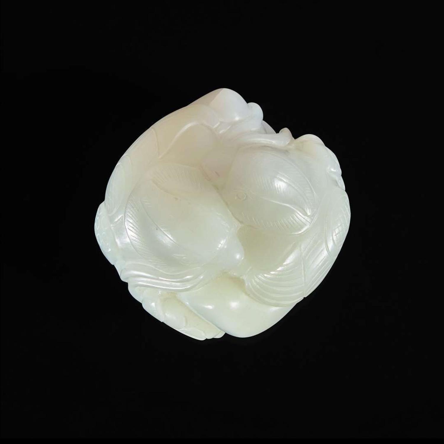 A Chinese white jade figural group depicting mandarin ducks 白玉雕双凫衔荷花 Qing Dynasty ?