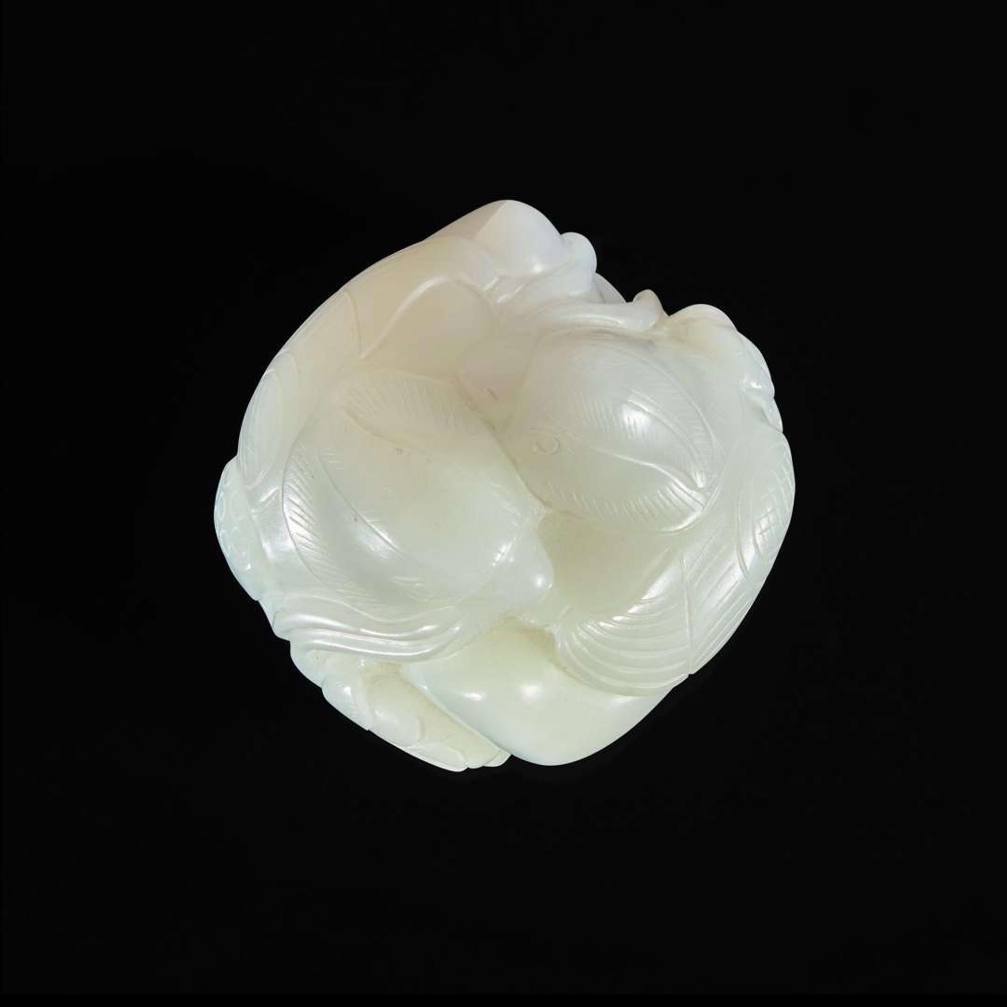A Chinese white jade figural group depicting mandarin ducks 白玉雕双凫衔荷花 Qing Dynasty ?