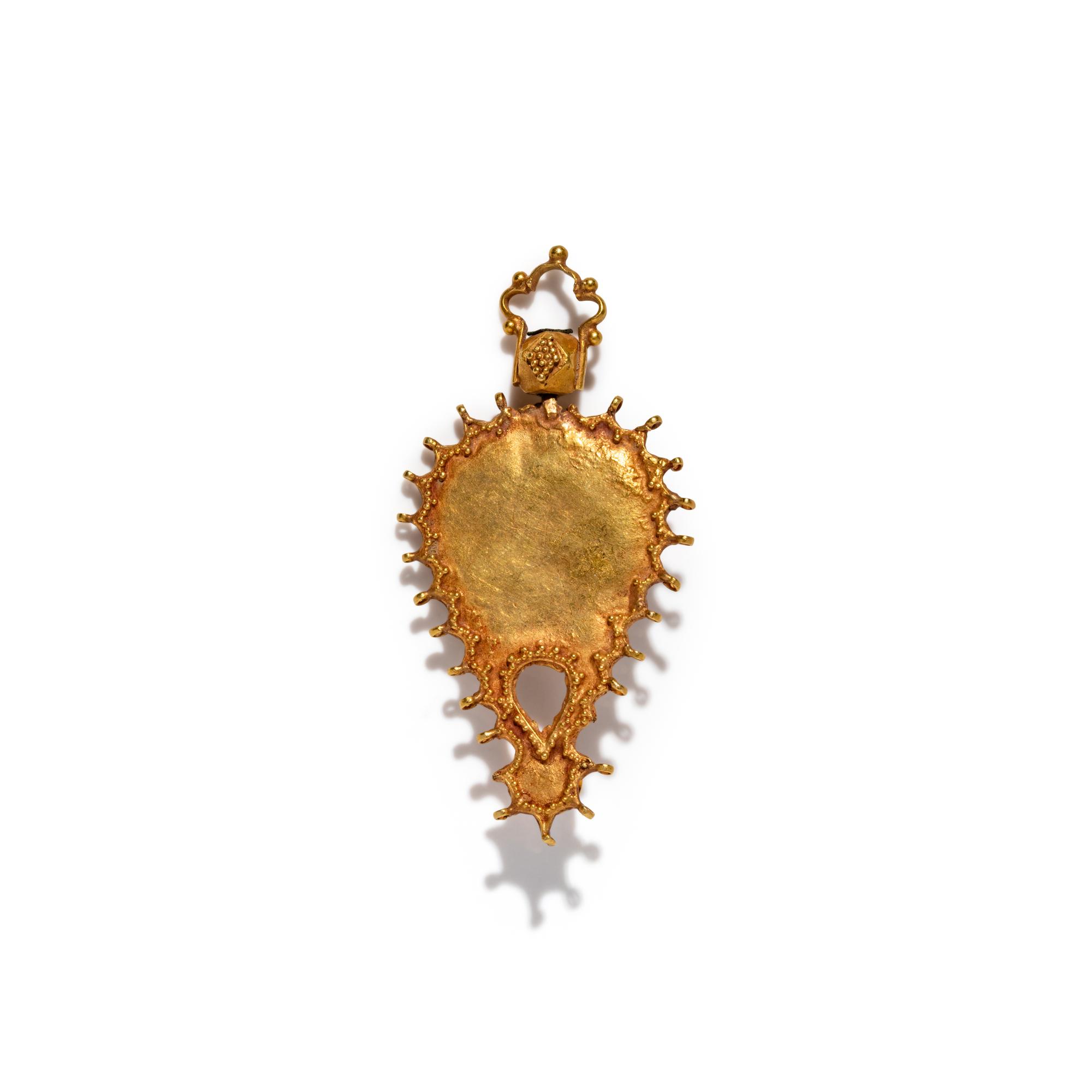 An Islamic Gold and Turquoise Pendant