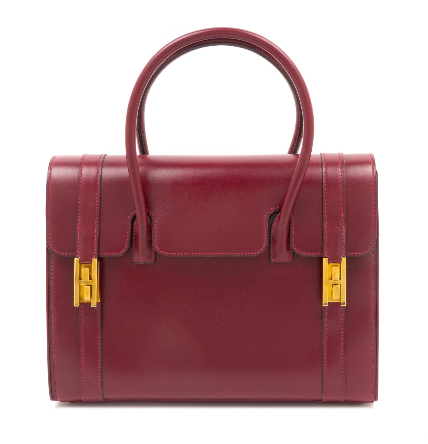 An Hermes Oxblood Leather Handbag, 10.5" x 8" x 4".