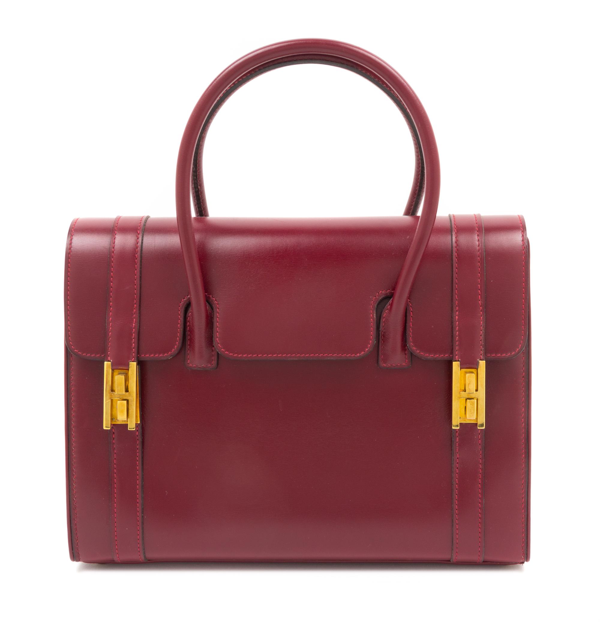 An Hermes Oxblood Leather Handbag, 10.5" x 8" x 4".