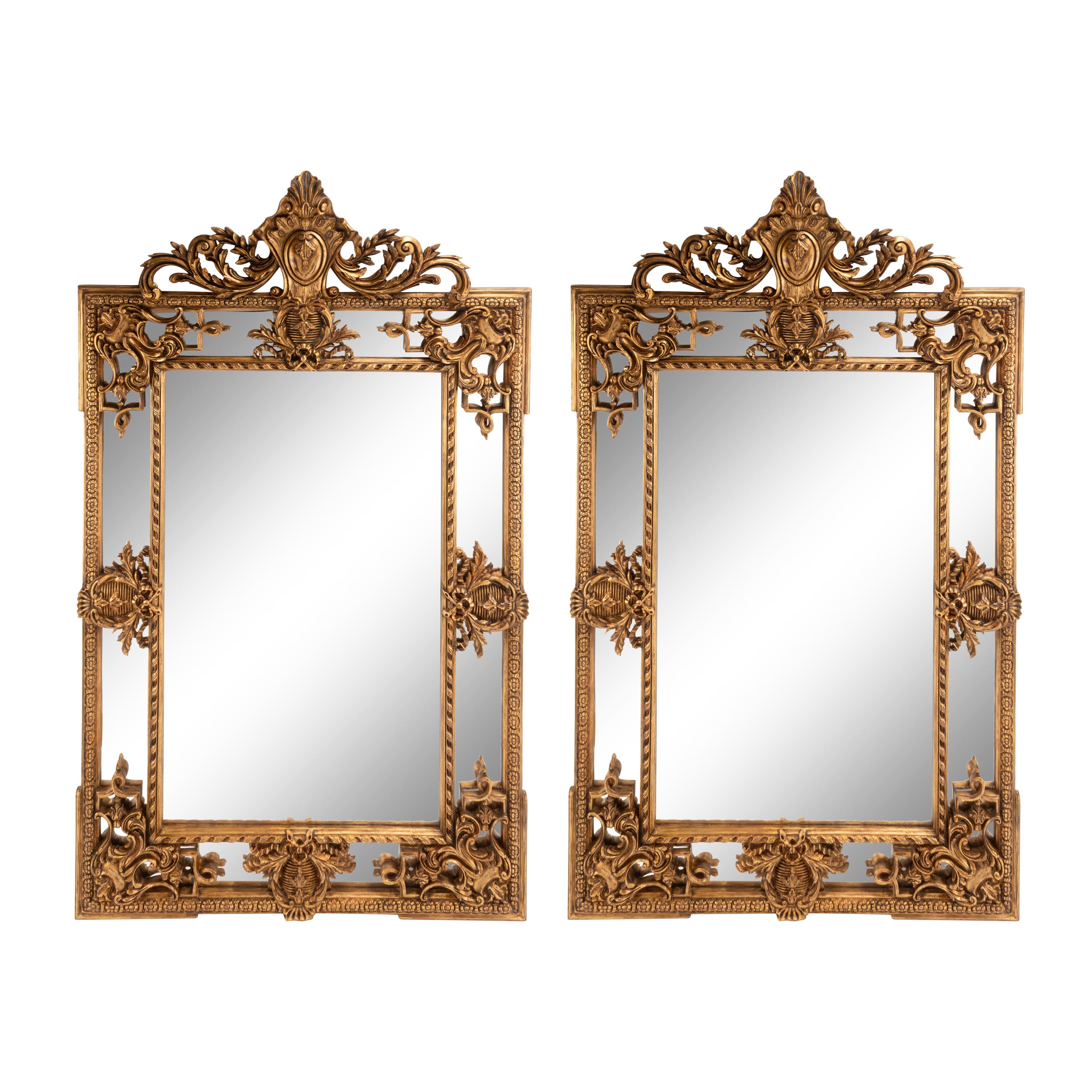 A Pair of Large Régence Style Giltwood Mirrors