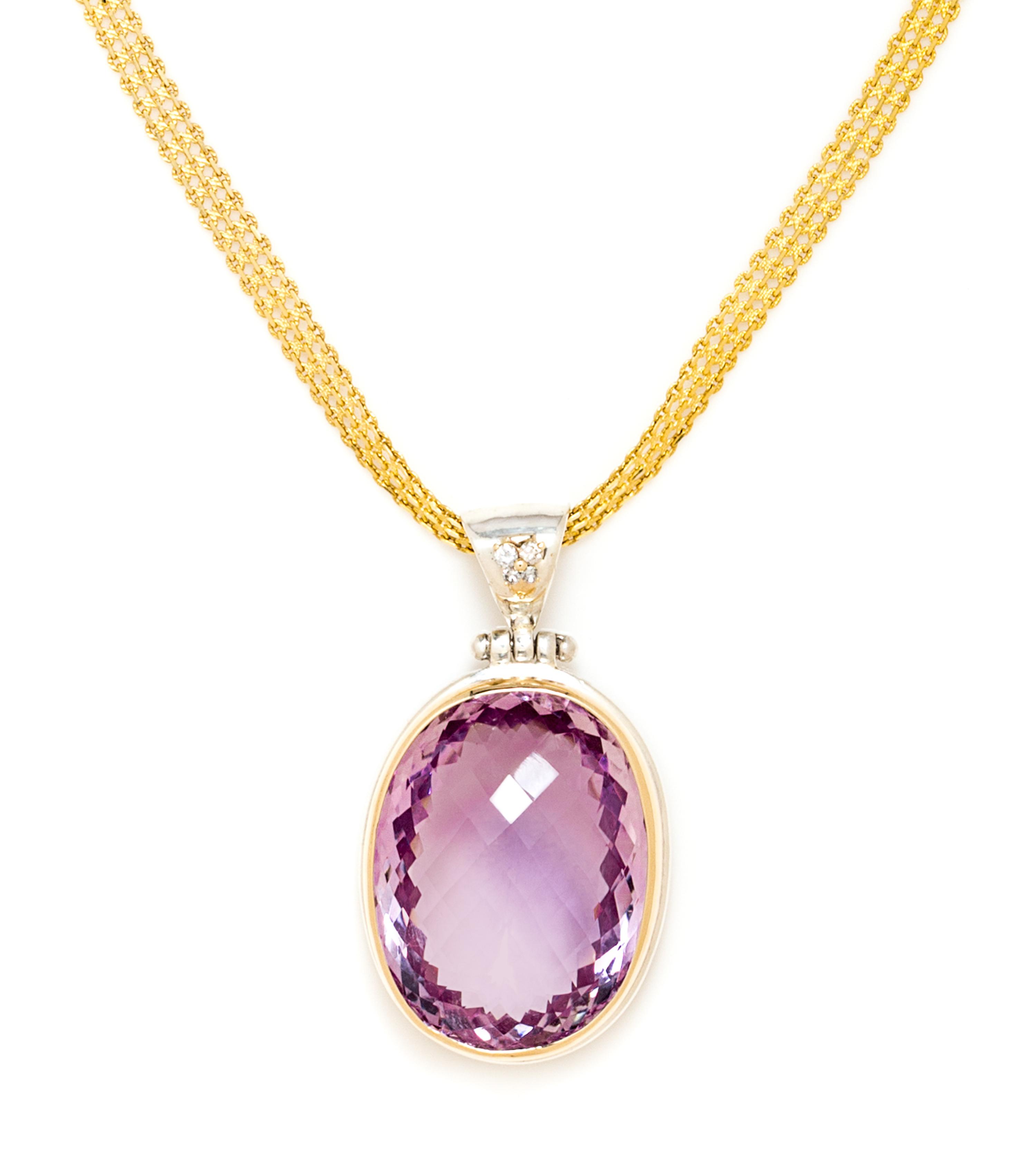 A Sterling Silver, 14 Karat Yellow Gold, Amethyst and Diamond Pendant, 39.60 dwts.