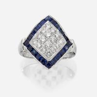 An eighteen karat white gold, diamond, and sapphire ring