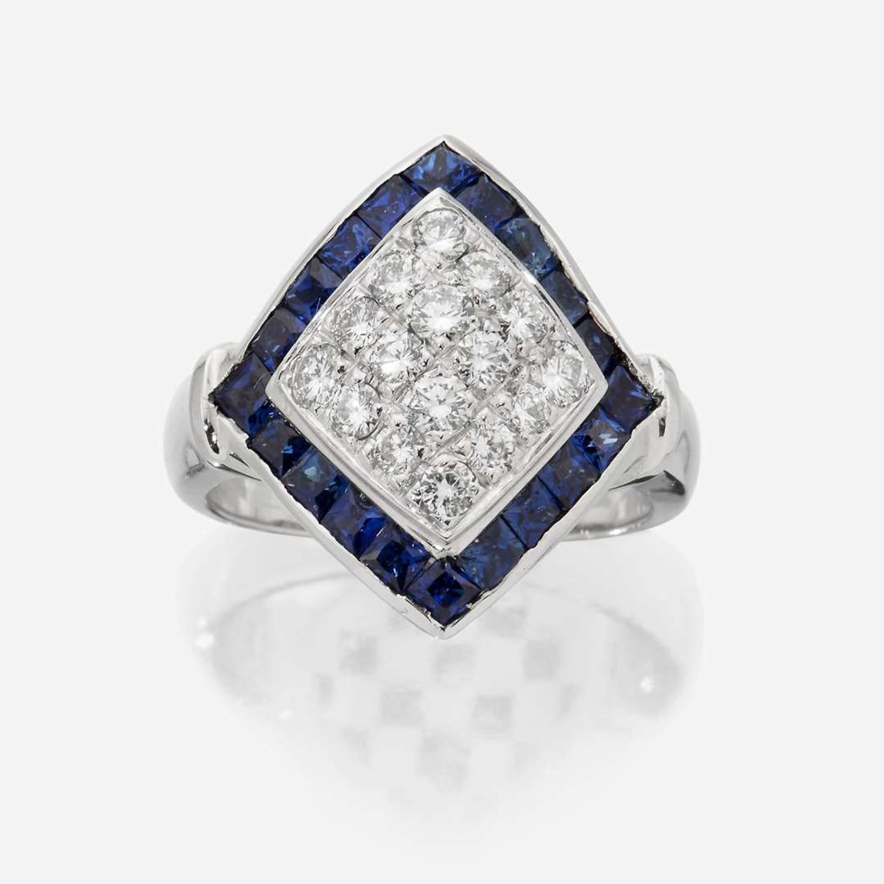 An eighteen karat white gold, diamond, and sapphire ring