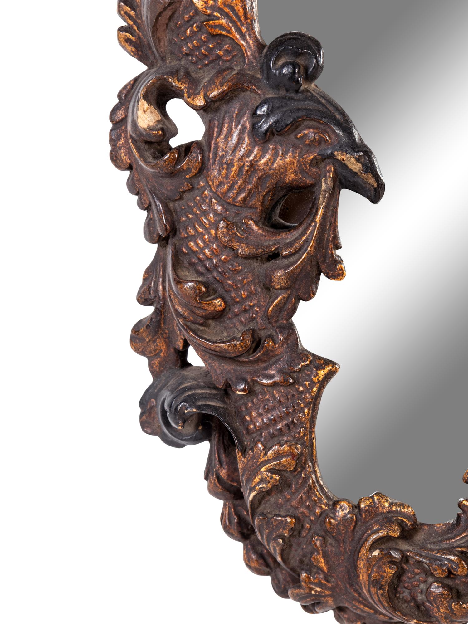 An Italian Baroque Style Giltwood Mirror