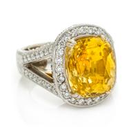 A Platinum, Gold, Yellow Sapphire and Diamond Ring, 15.80 dwts.