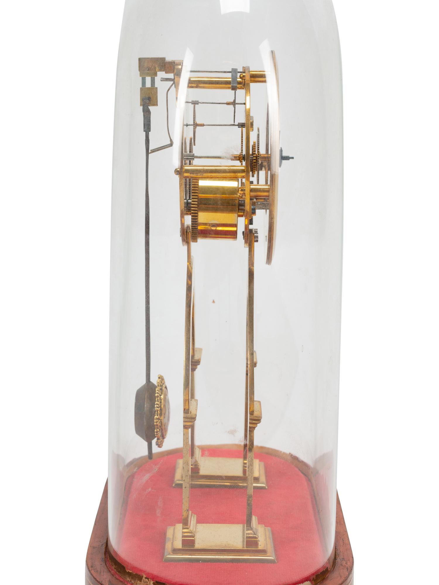 A Continental Gilt Bronze Skeleton Clock and Glass Dome