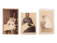 [EARLY PHOTOGRAPHY]. A group of 3 CDVs of African American women with white infants, comprising: