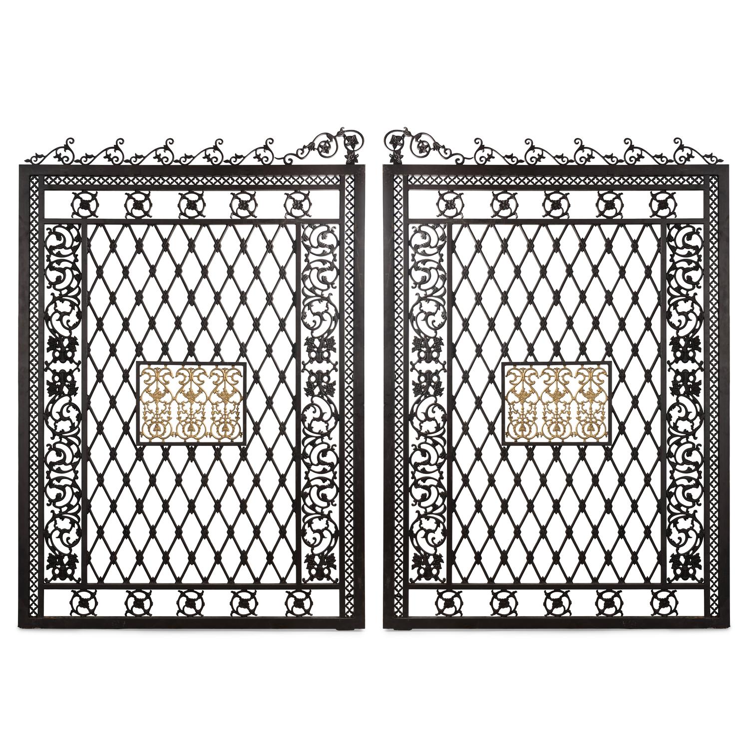A Pair of Large Parcel Gilt Iron Gates