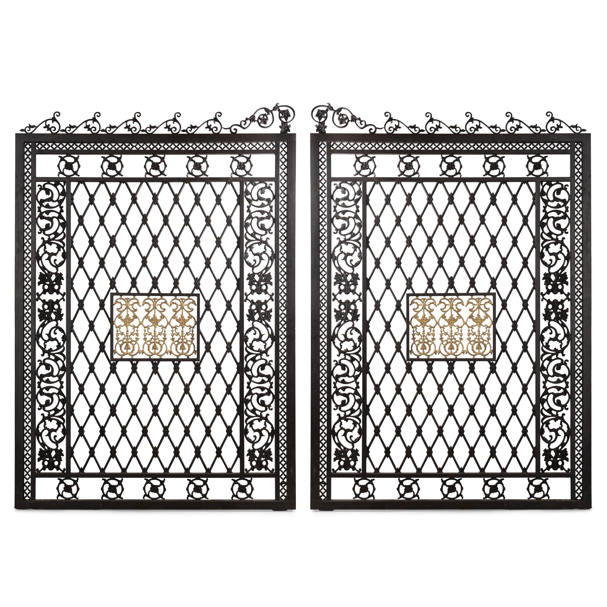 A Pair of Large Parcel Gilt Iron Gates