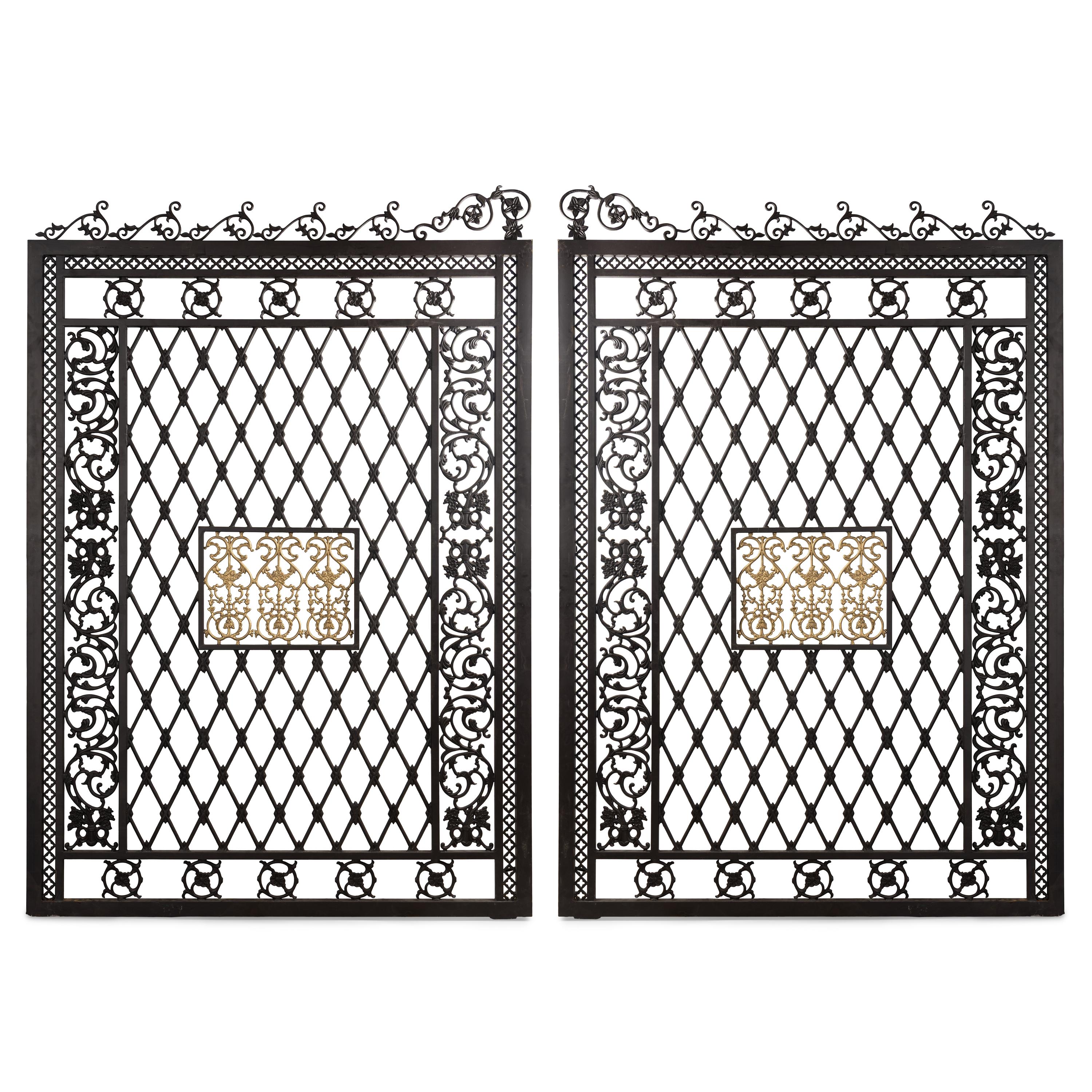 A Pair of Large Parcel Gilt Iron Gates
