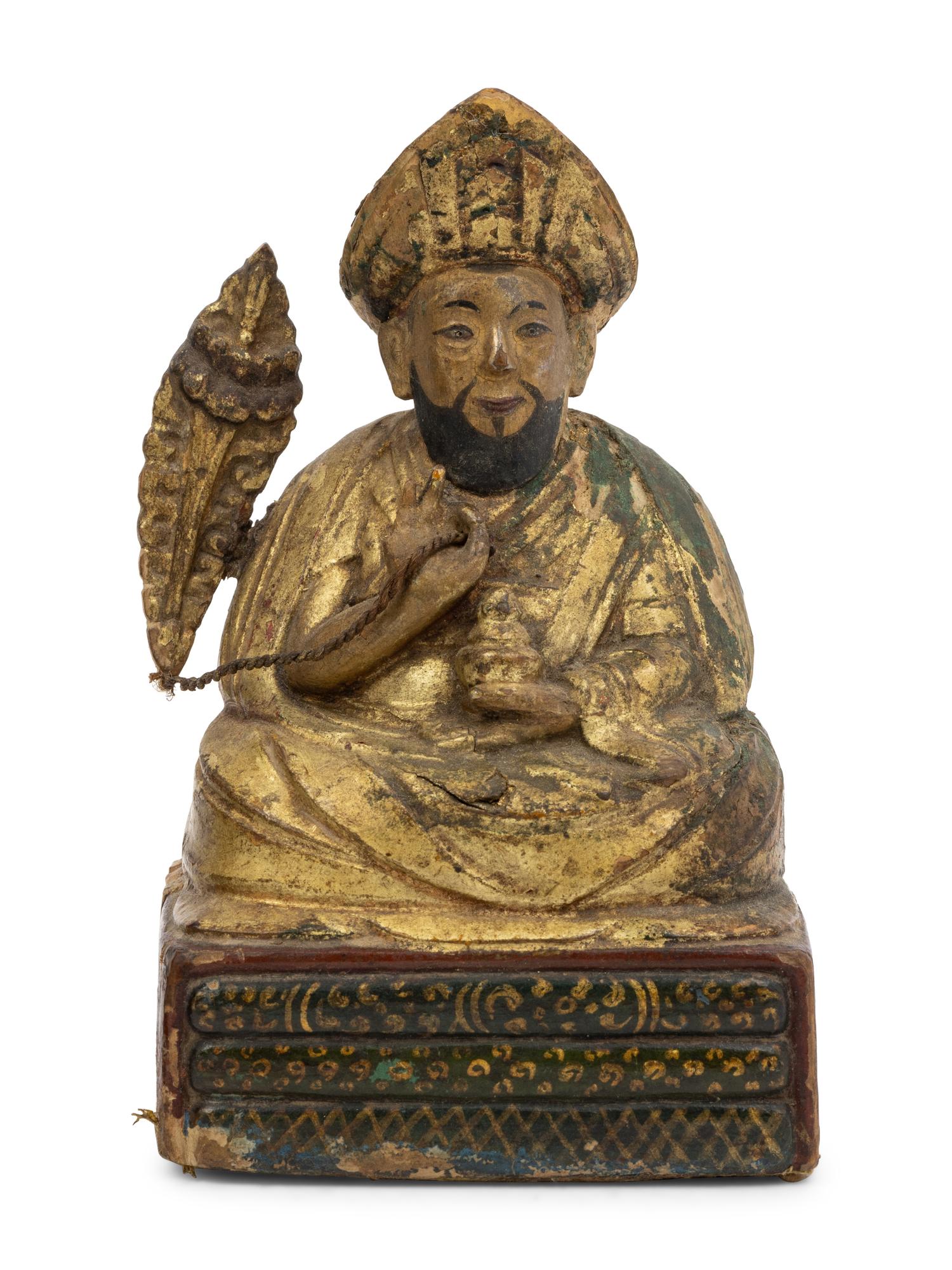 Three Sino-Tibetan Carved Wood Seated Figures
