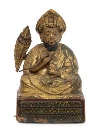 Three Sino-Tibetan Carved Wood Seated Figures