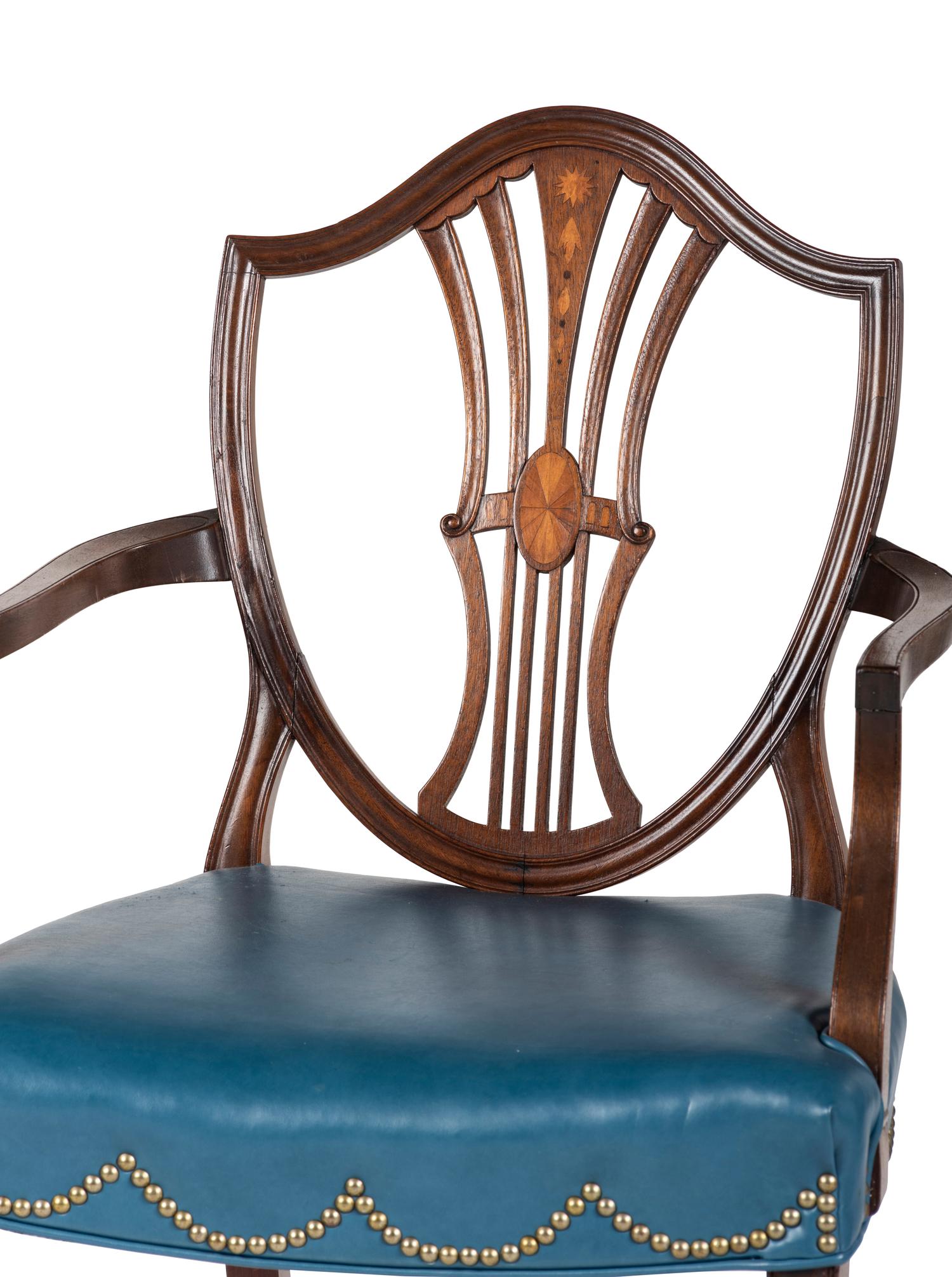 A Set of Eight Federal Style Inlaid and Volute-Carved Mahogany Shield-Back Dining Chairs