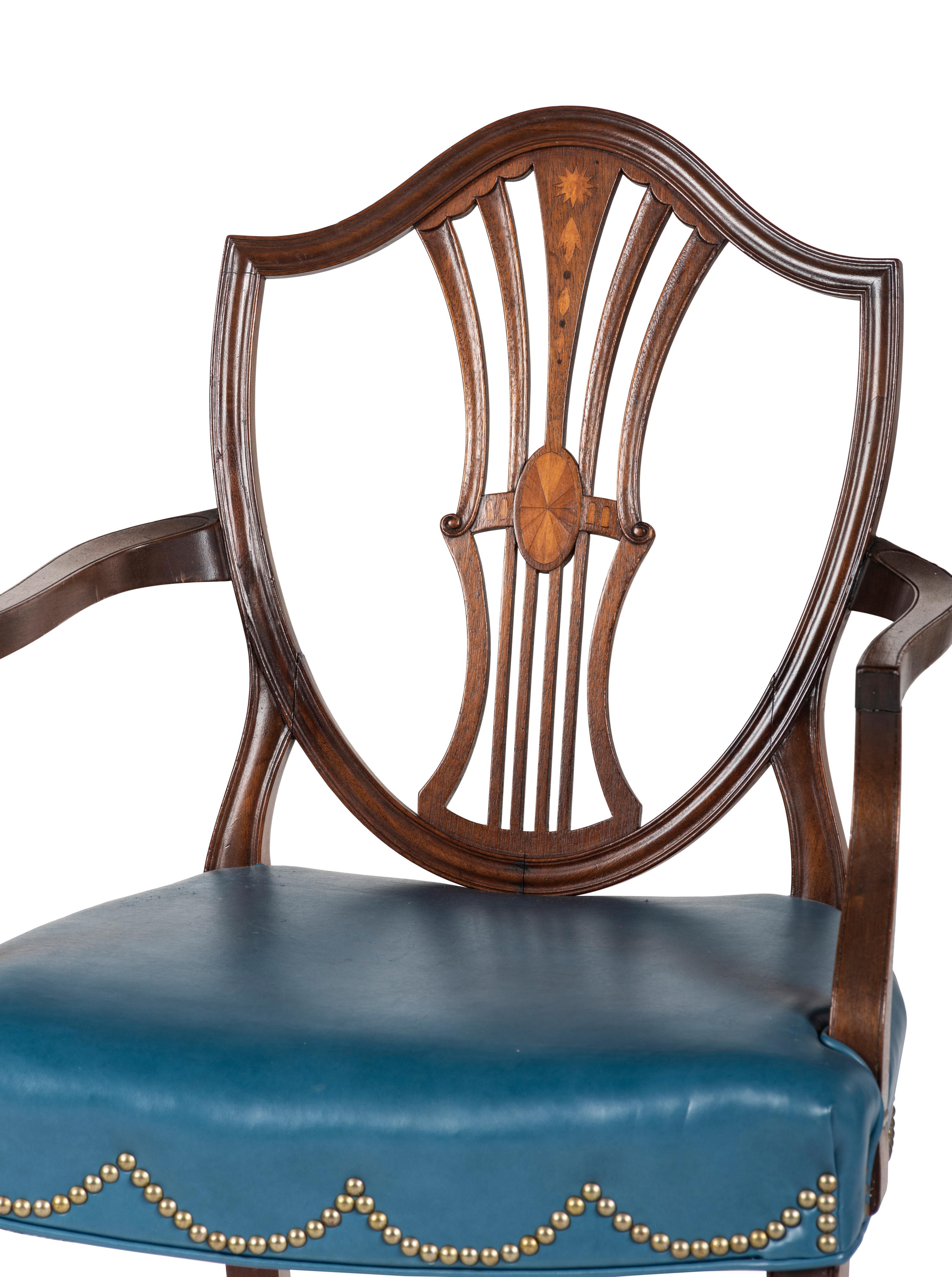 A Set of Eight Federal Style Inlaid and Volute-Carved Mahogany Shield-Back Dining Chairs