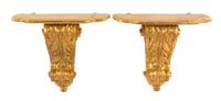 A Pair of Italian Giltwood Wall Brackets Height 21 x width 24 1/4 x depth 11 5/8 inches. — 20TH CENTURY