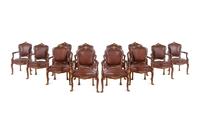A Set of Fourteen Louis XV Style Gilt Bronze Mounted Walnut Dining Chairs