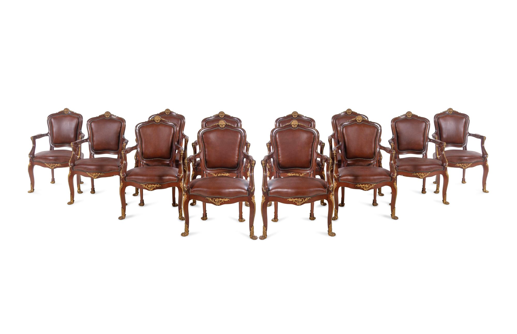 A Set of Fourteen Louis XV Style Gilt Bronze Mounted Walnut Dining Chairs