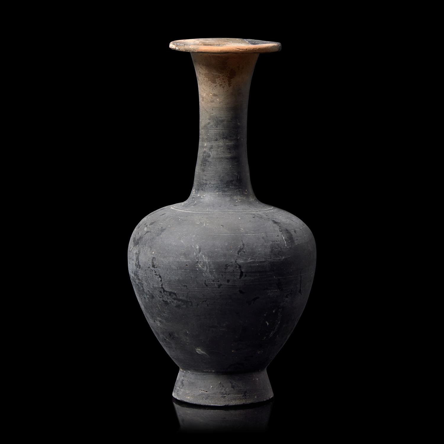 A Chinese Burnished Blackware Vase, Tang Dynasty 唐 黑陶長頸瓶