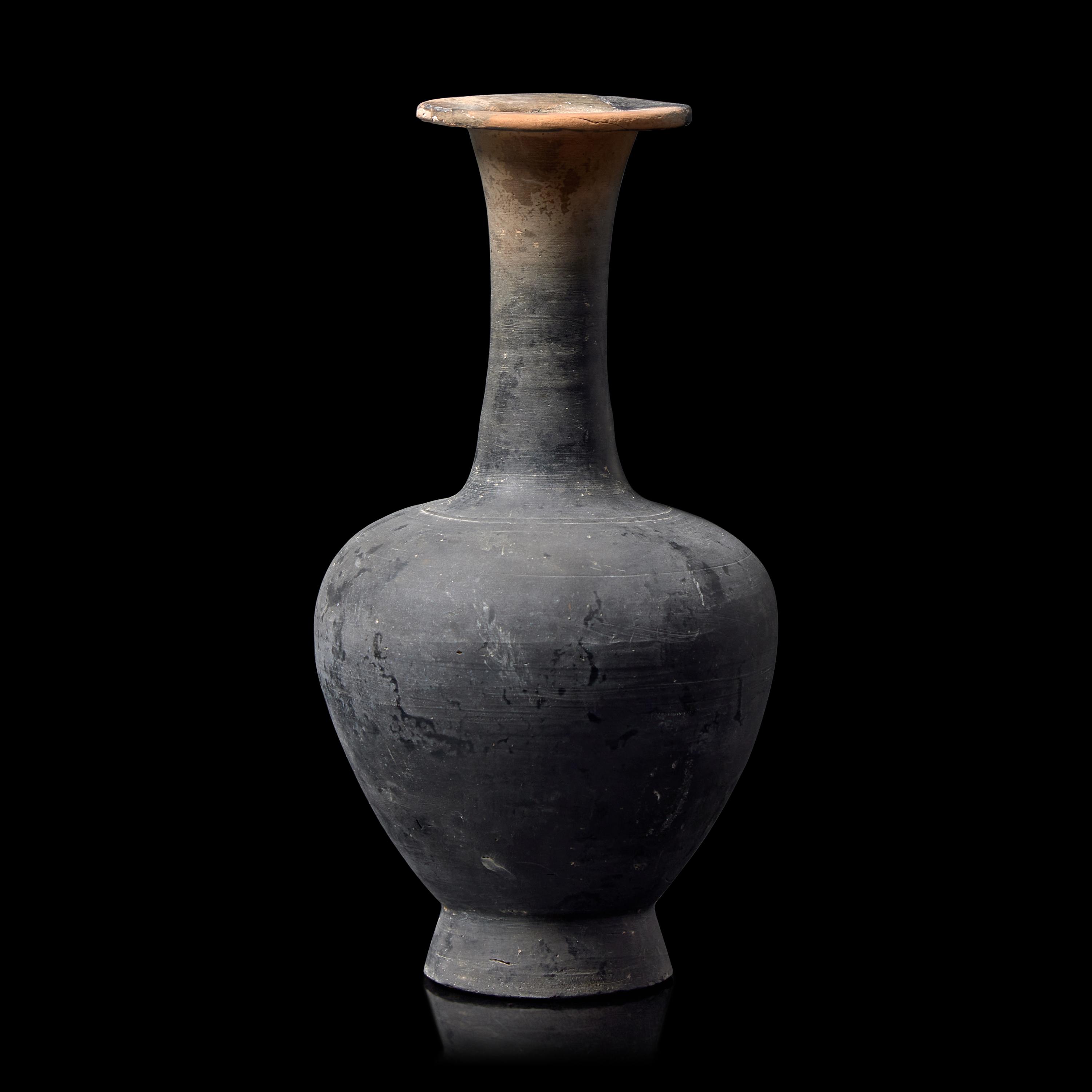 A Chinese Burnished Blackware Vase, Tang Dynasty 唐 黑陶長頸瓶