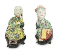 A Pair of Chinese Porcelain Reclining Figures