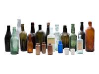 [AMERICANA]. Assembled collection of American glass and ceramic liquor and utility bottles.
