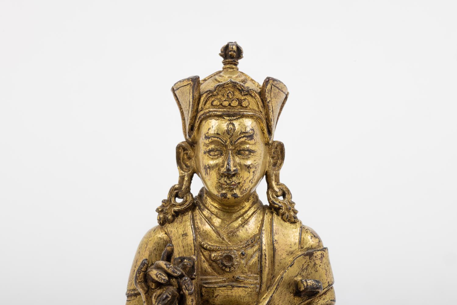 A Tibetan Gilt Bronze Figure of a Seated Karmapa