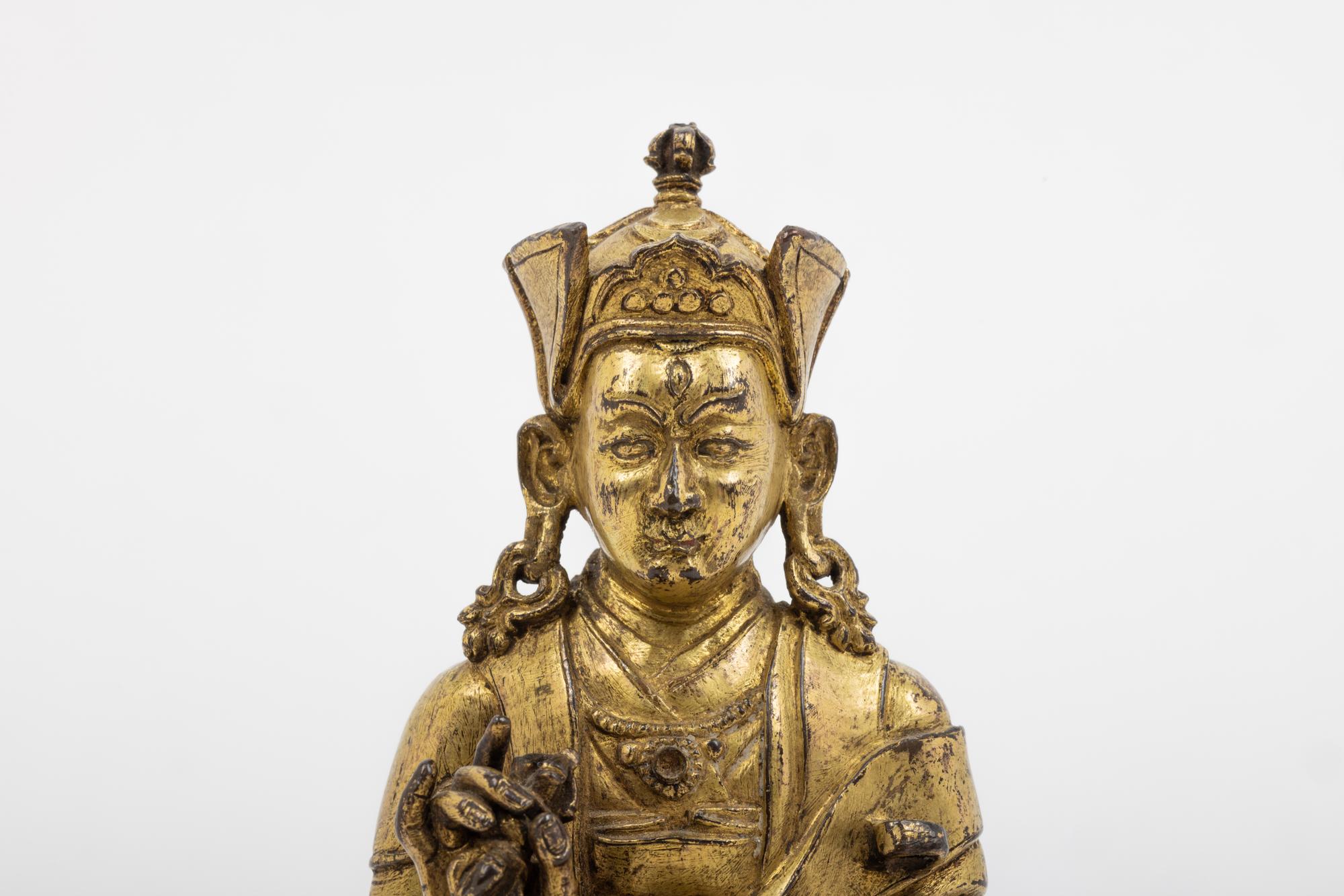 A Tibetan Gilt Bronze Figure of a Seated Karmapa