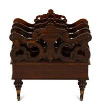 A Late Regency Carved Mahogany Canterbury