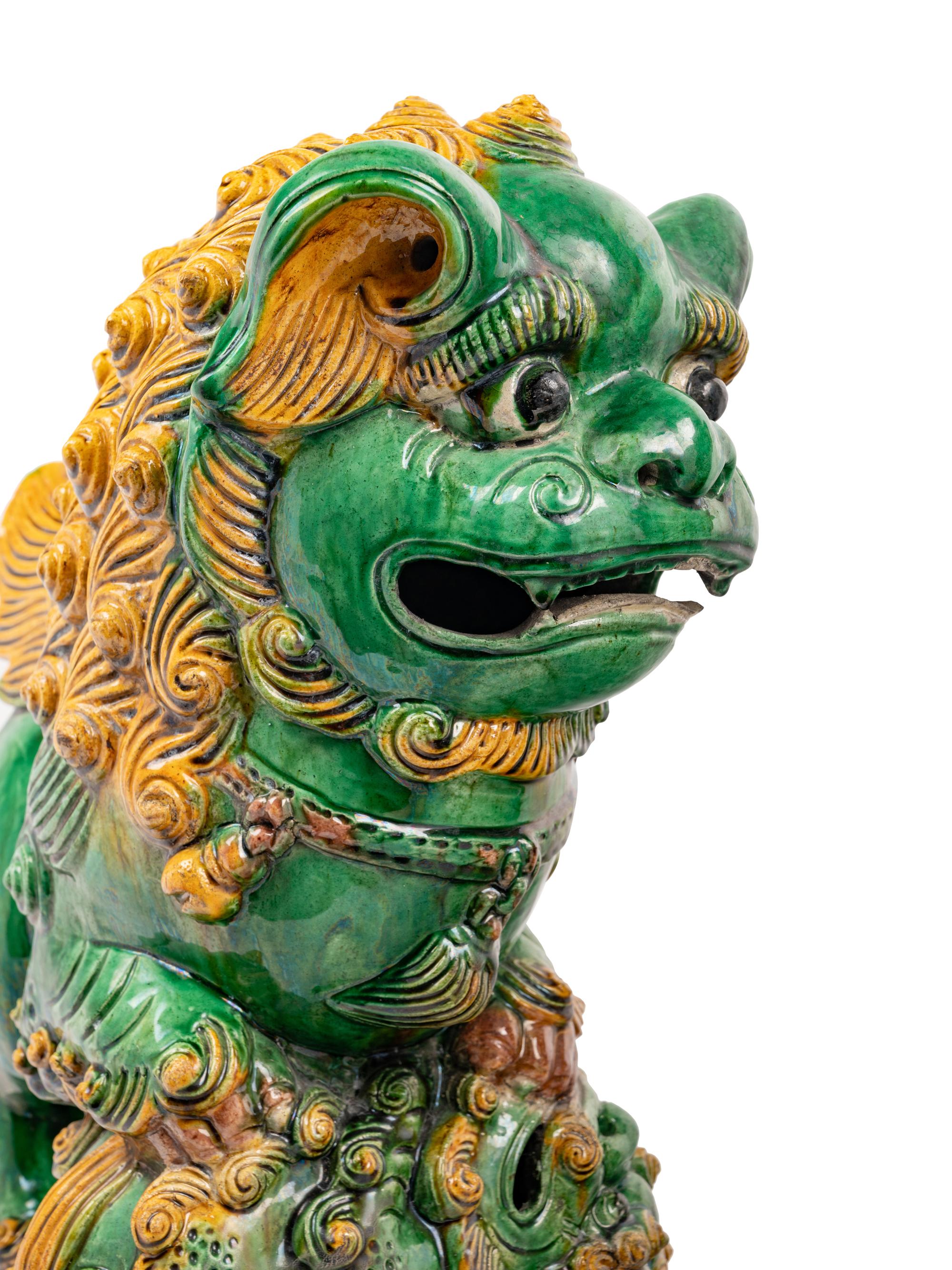 A Pair of Chinese Sancai Glazed Porcelain Figures of Fu Lions