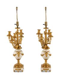 A Pair of Louis XVI Style Gilt Bronze and White Marble Six-Light Candelabra