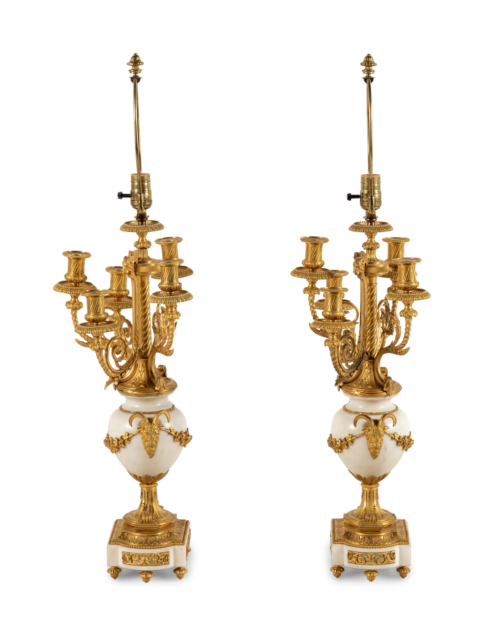 A Pair of Louis XVI Style Gilt Bronze and White Marble Six-Light Candelabra