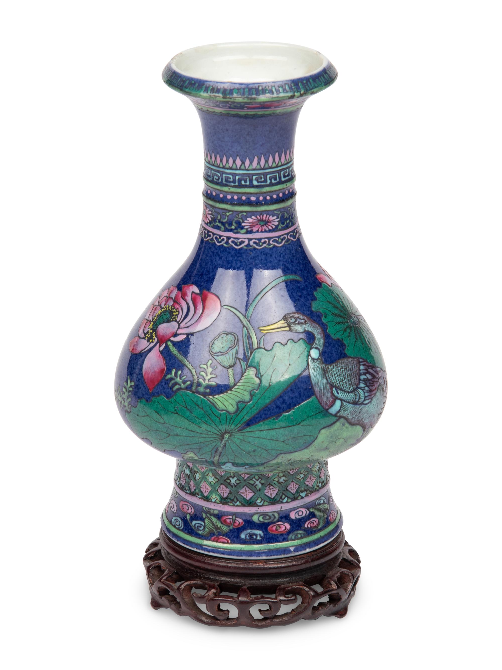 A Chinese Blue Ground Famille Rose Vase with Stand