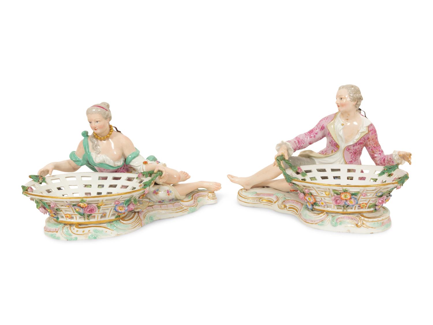 A Pair of German Porcelain Figural Sweetmeat Baskets