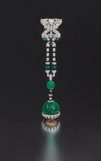 An Art Deco Platinum, Emerald, Diamond, Onyx and Enamel Lapel Watch, Cartier, 37.00 dwts.