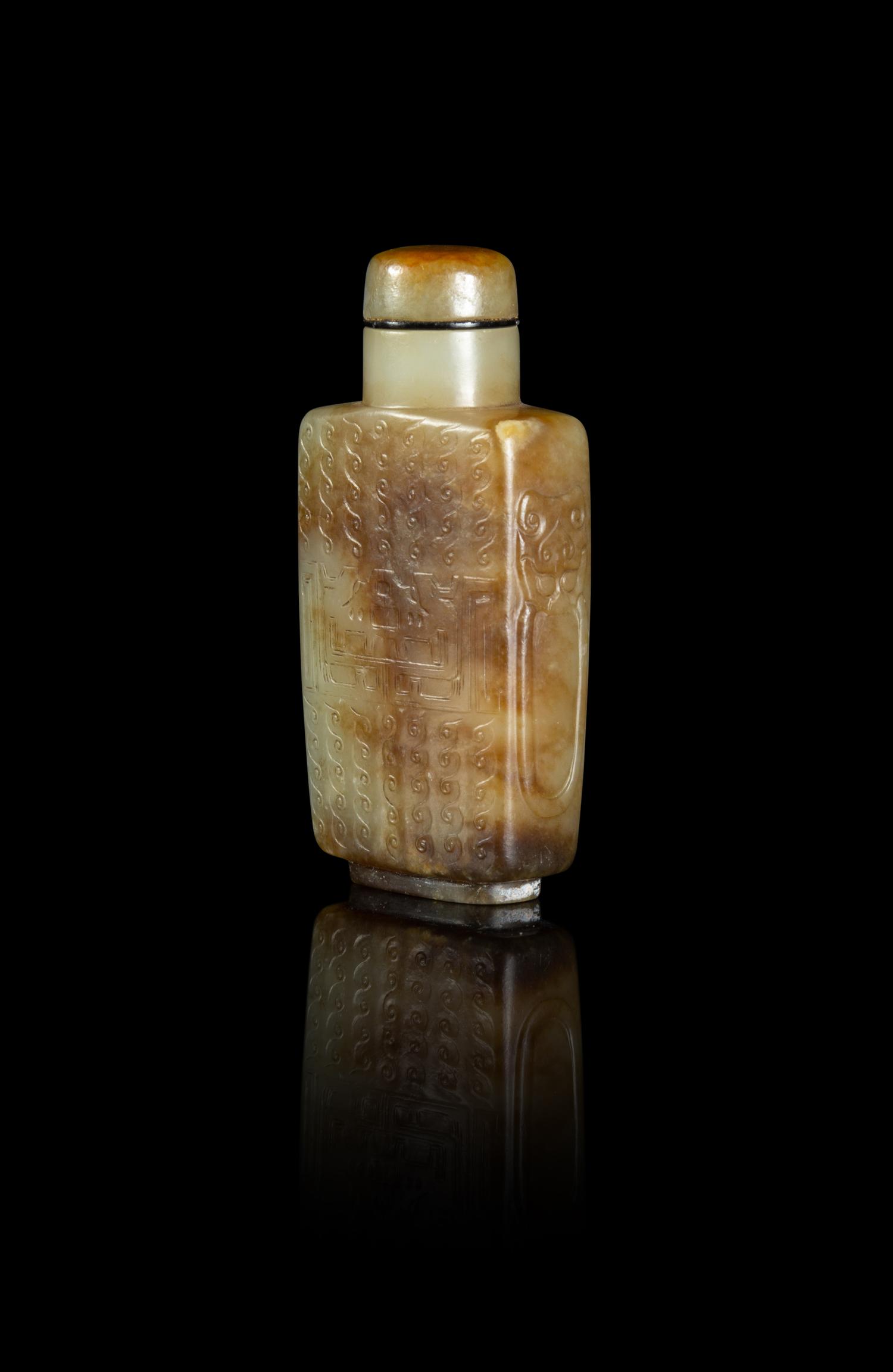 A Russet and Celadon Jade 'Kuilong' Snuff Bottle
