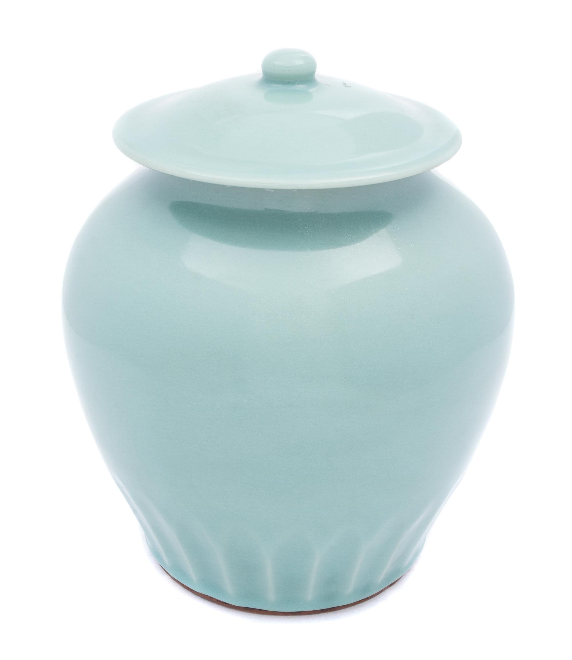 A Chinese Celadon Glazed Porcelain Covered Jar 18TH CENTURY Height 9 1/8 inches. — 18TH CENTURY