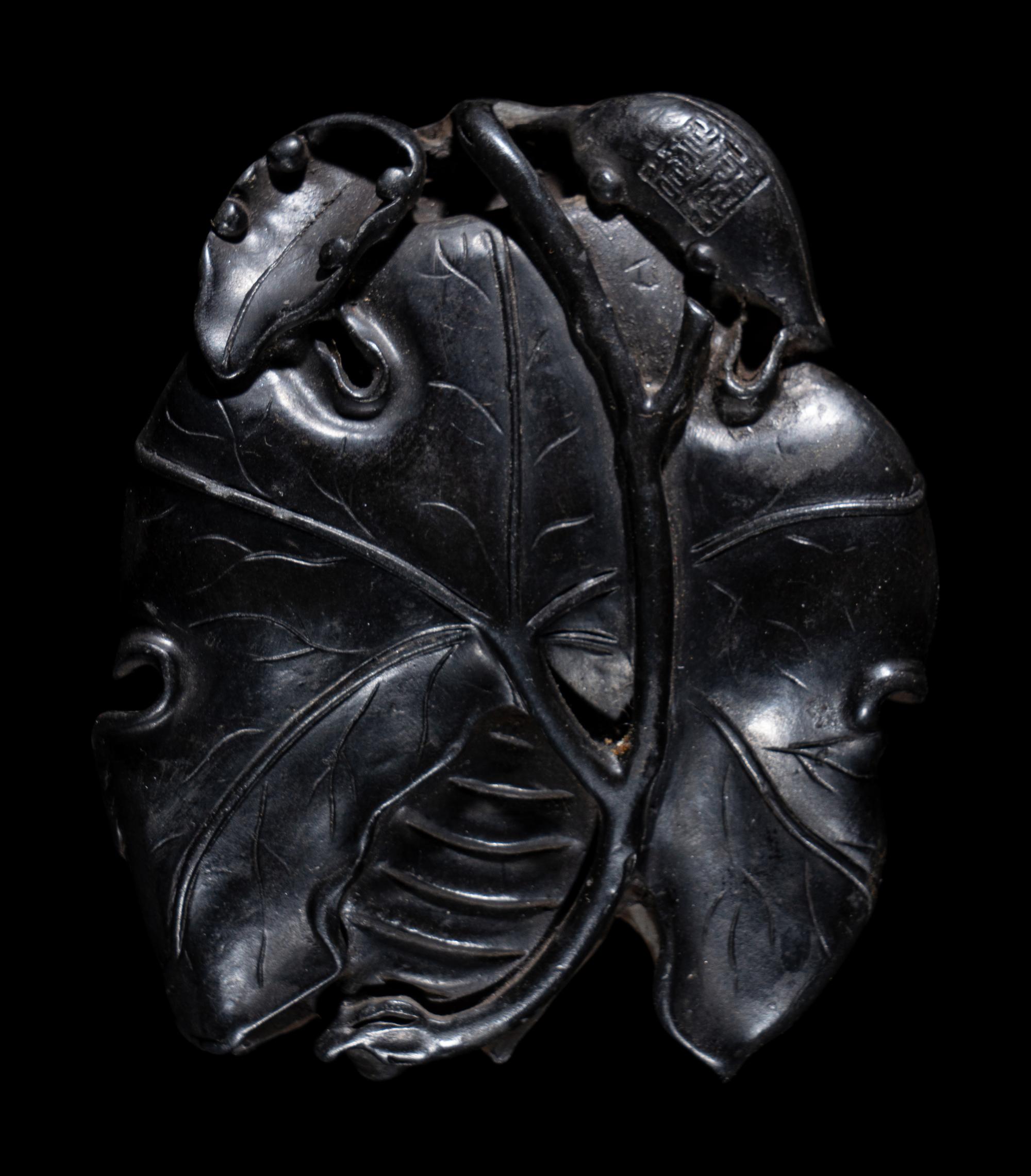 Two Chinese Carved Wood Pendants