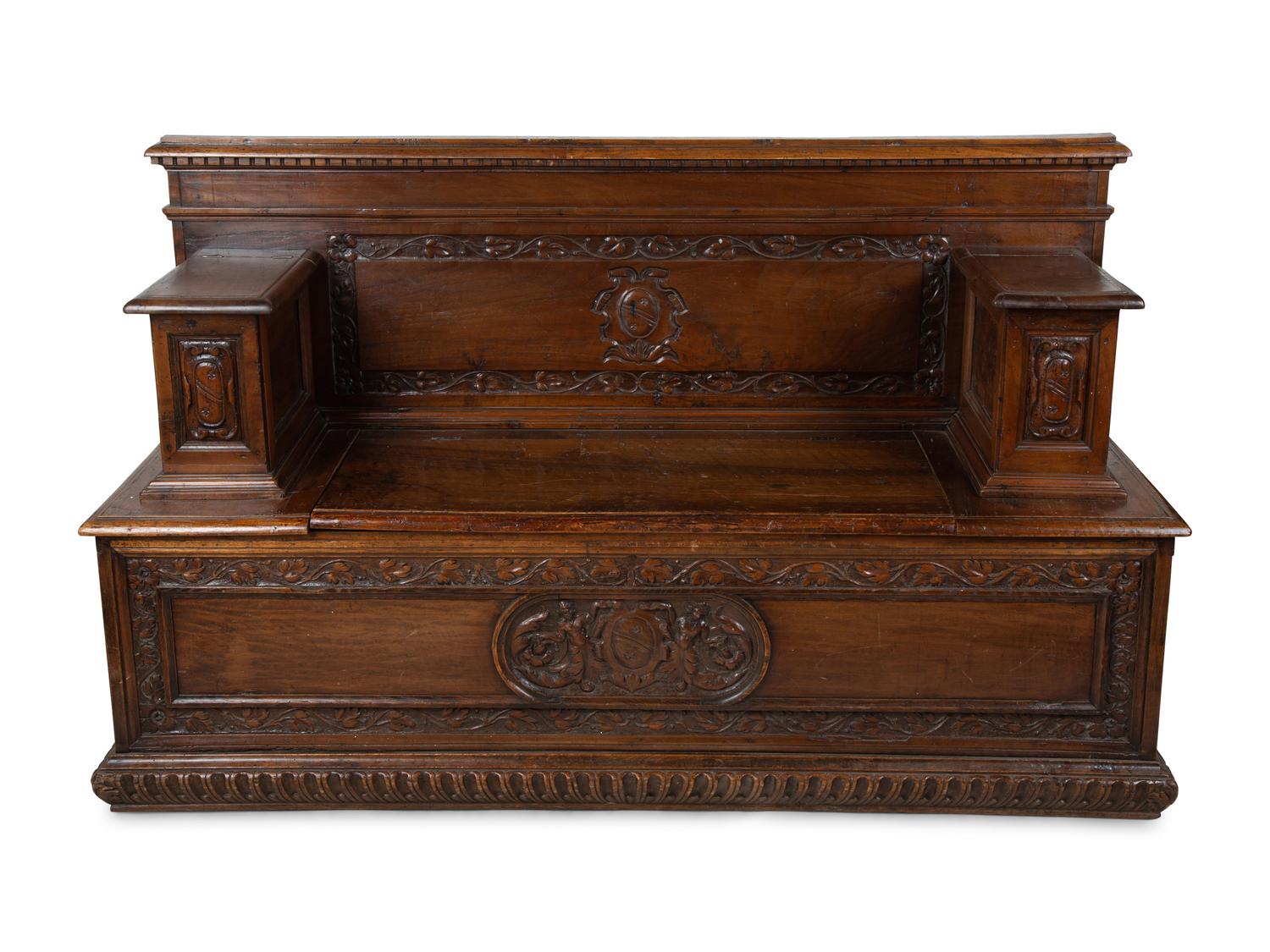 An Italian Carved Walnut Cassapanca — 17/18TH CENTURY AND LATER