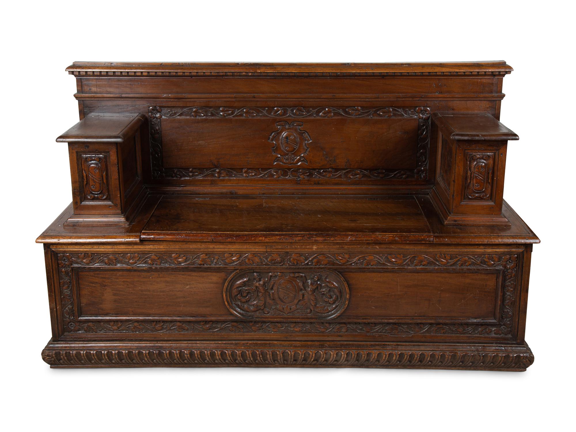 An Italian Carved Walnut Cassapanca — 17/18TH CENTURY AND LATER