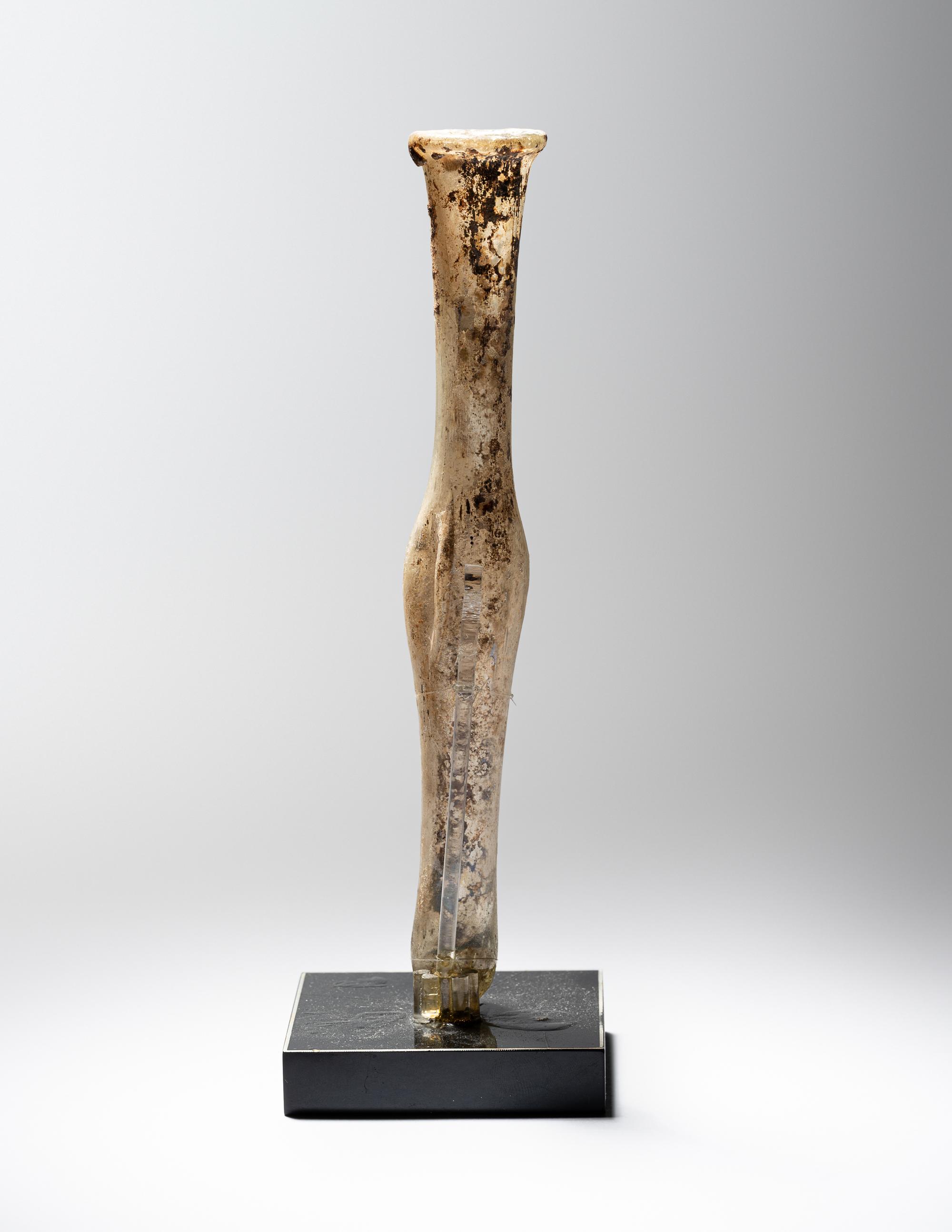 A Roman Pale Yellow Glass Unguentarium