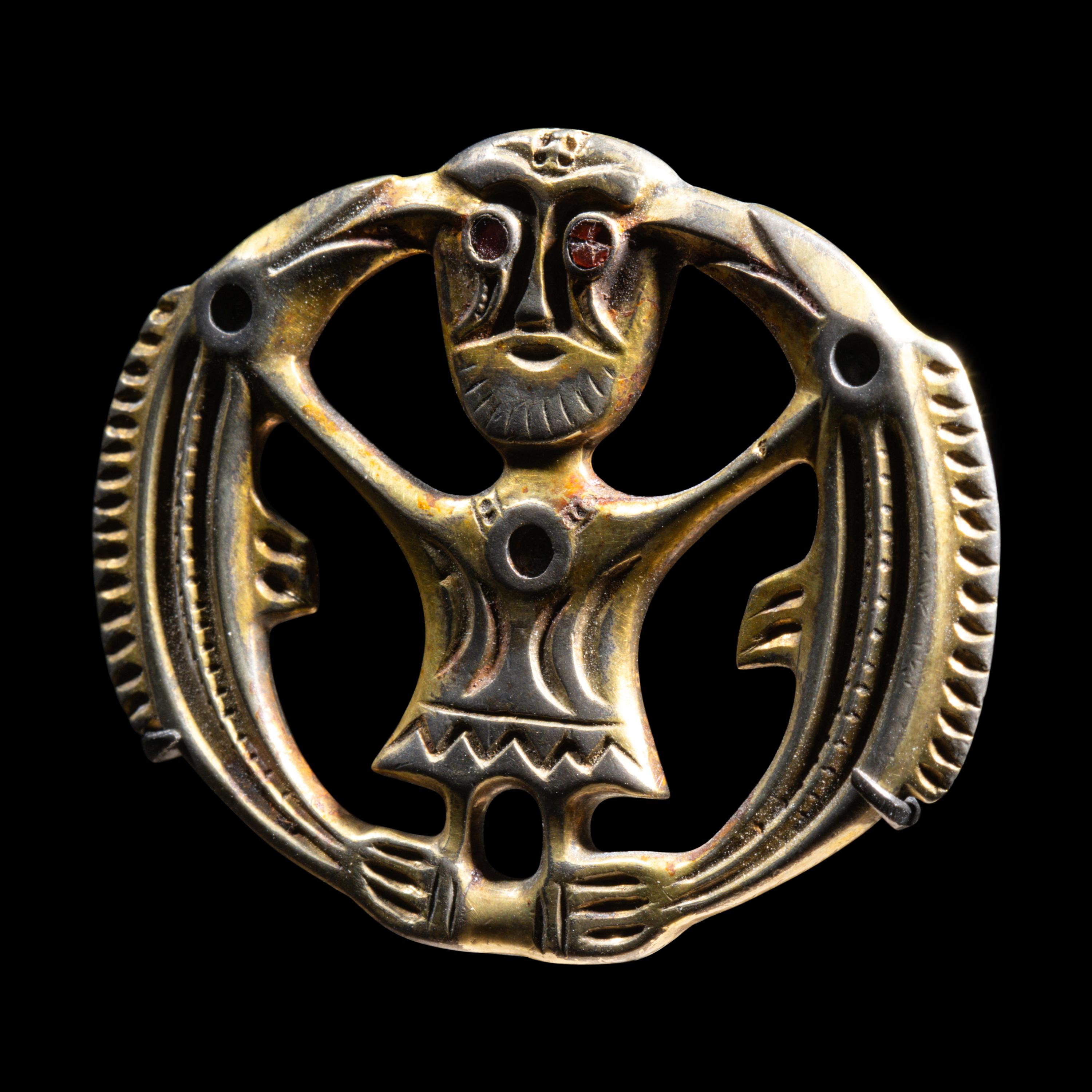 A Migration Period Gilt-Silver Brooch with Odin