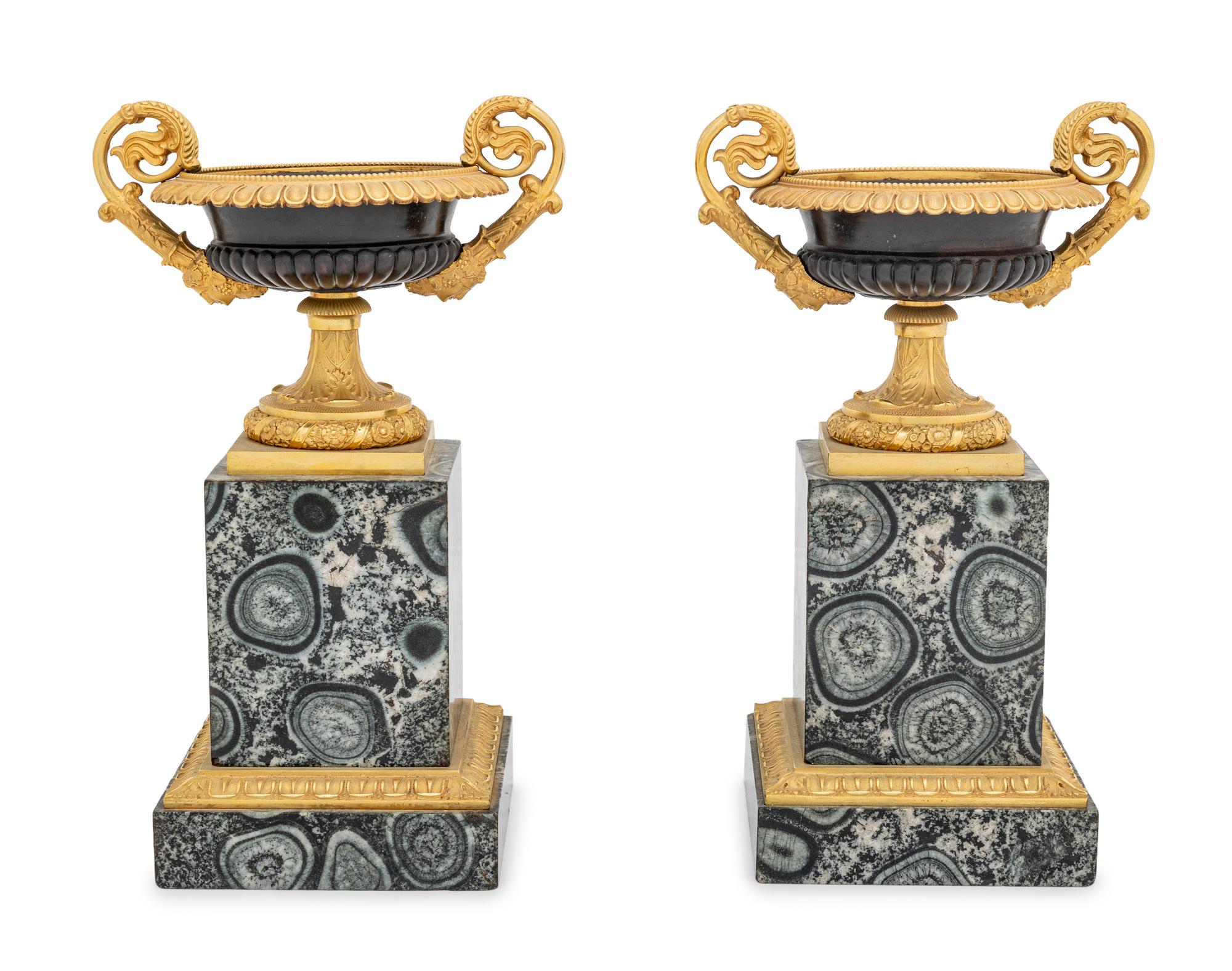 A Pair of Restauration Gilt and Patinated Bronze and Granite Urns