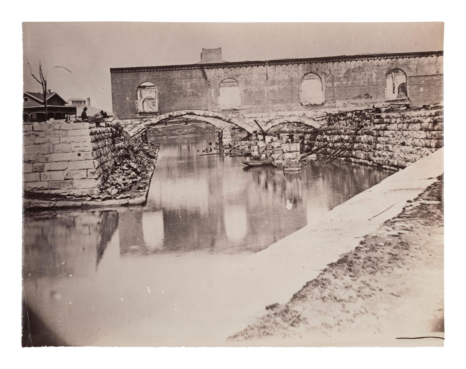 [CIVIL WAR]. GARDNER, Alexander (1821-1882). Canal and Ruins of Richmond and Danville Railroad Depot, Richmond, Virginia. 1865.