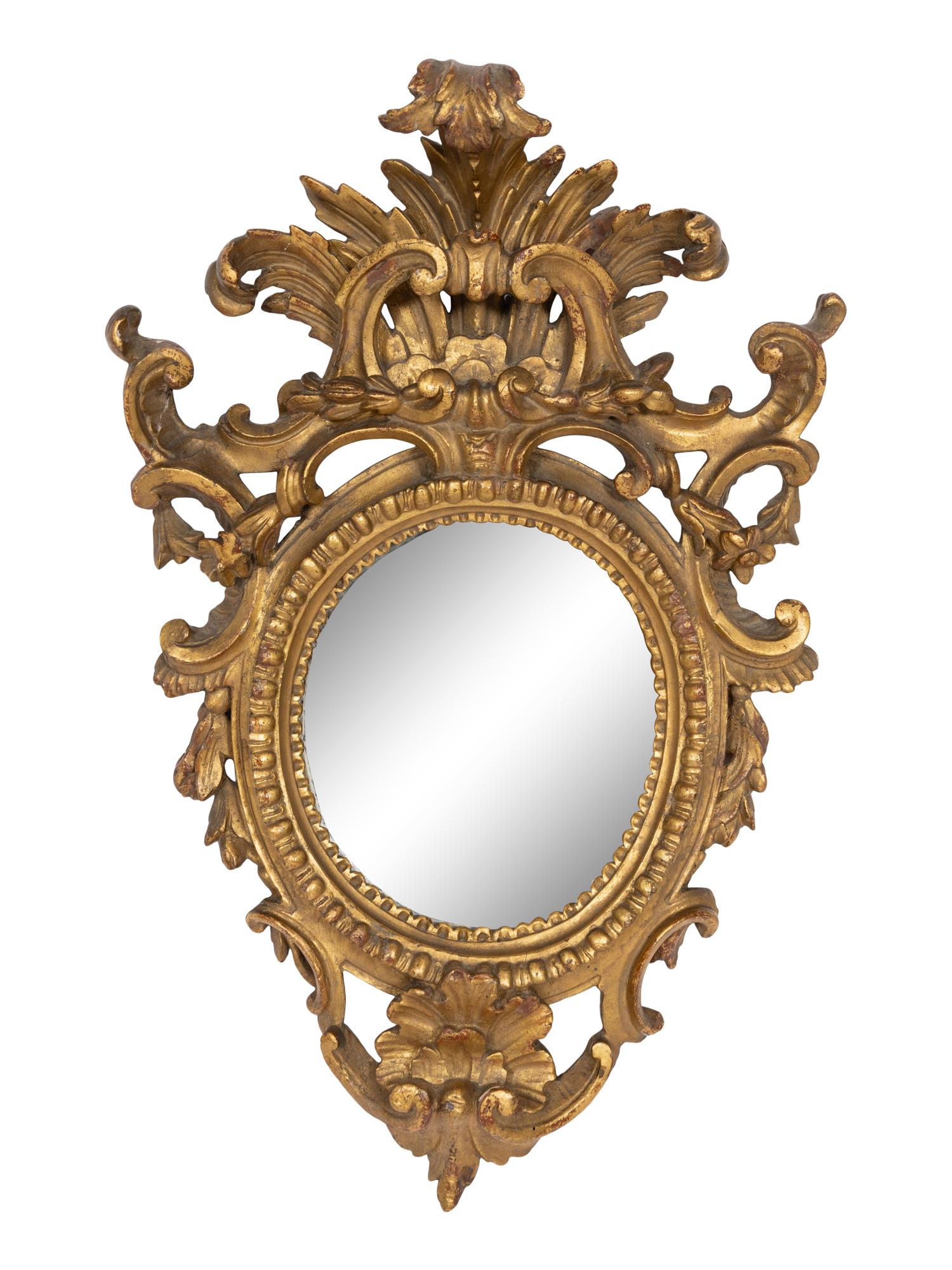 A Pair of Italian Baroque Oval Giltwood Mirrors