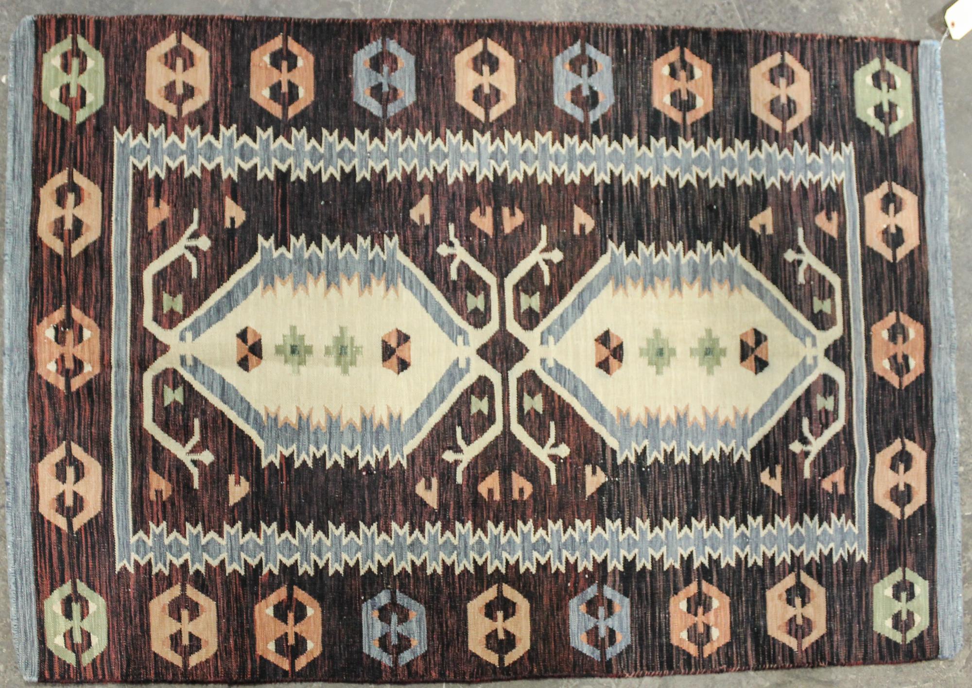 A Flatweave Kilim 5 feet 10 x 3 feet 11 inches. — 20TH CENTURY