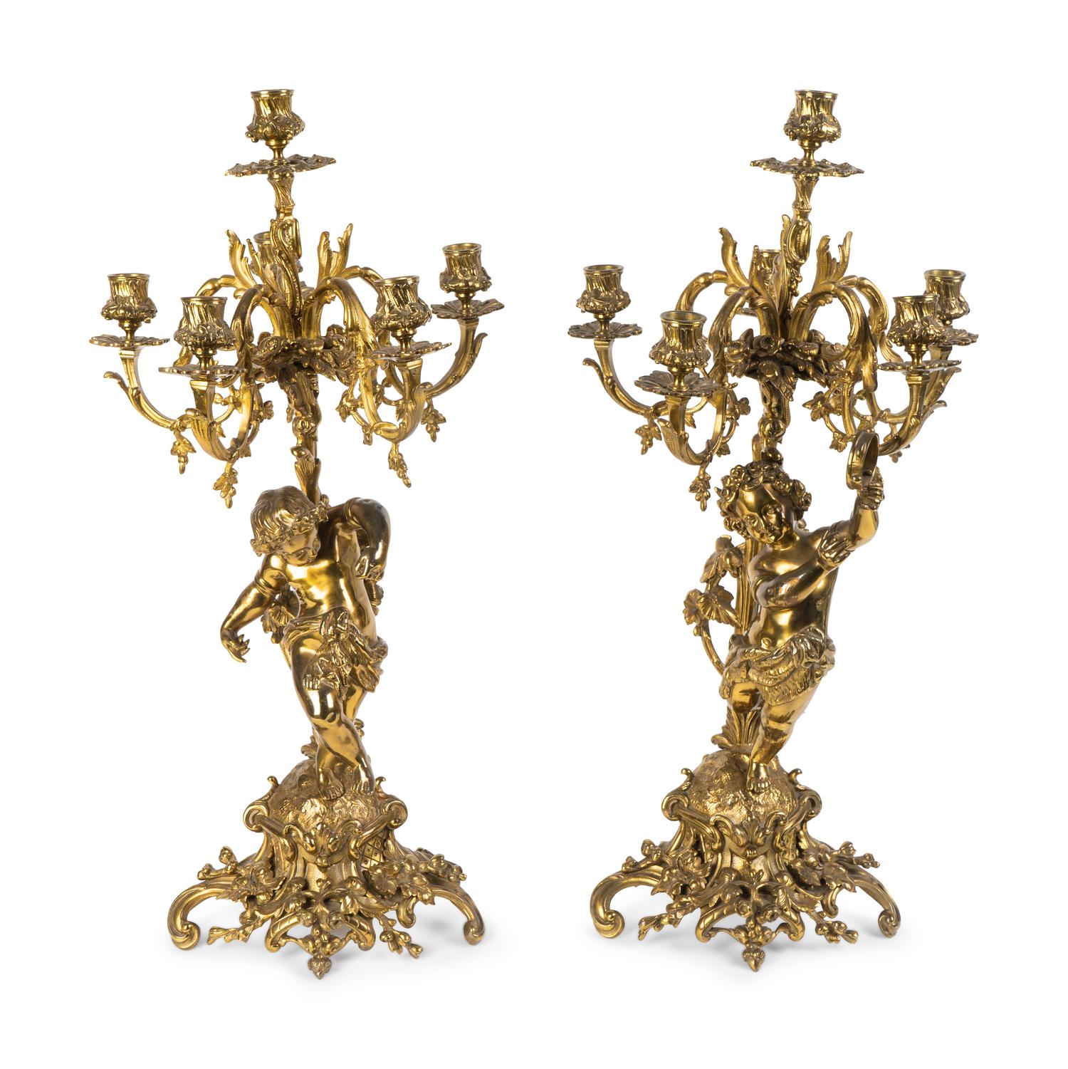 A Pair of Rococo Style Brass Figural Candelabra