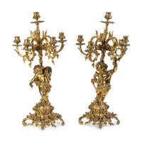 A Pair of Rococo Style Brass Figural Candelabra