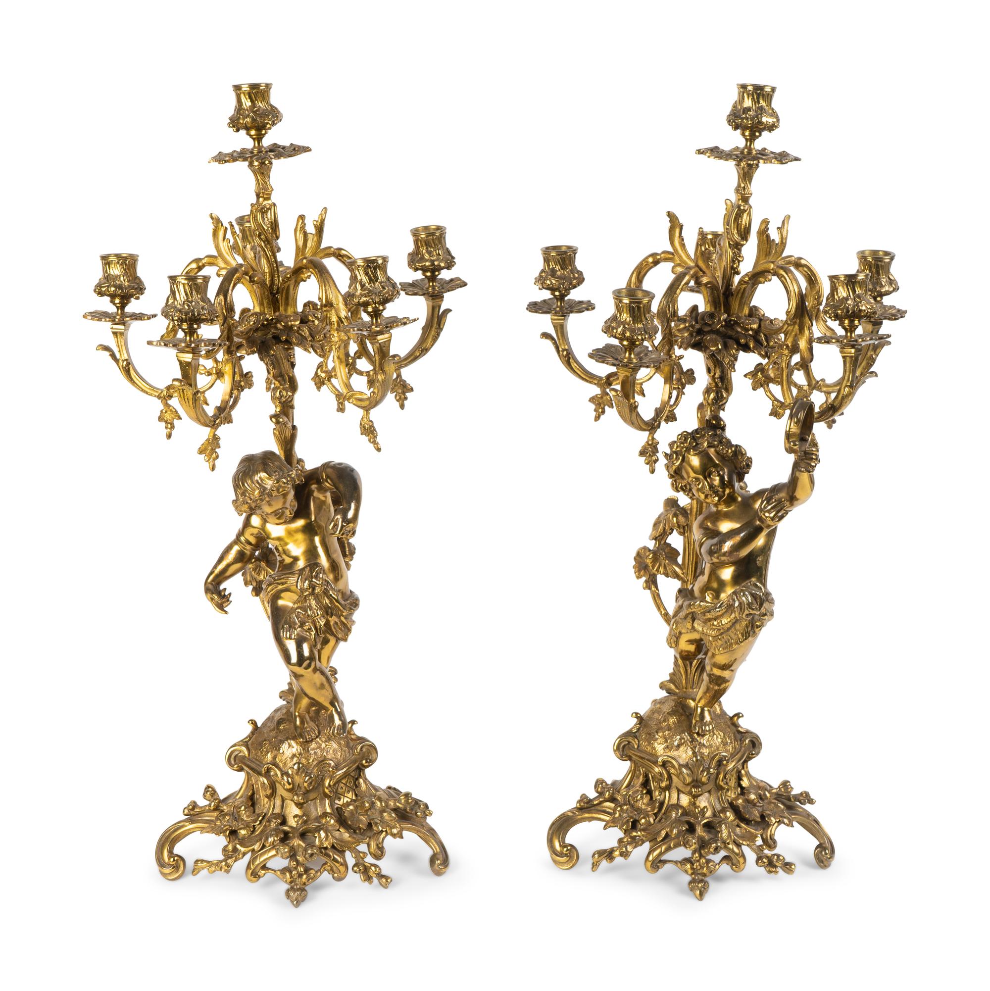 A Pair of Rococo Style Brass Figural Candelabra